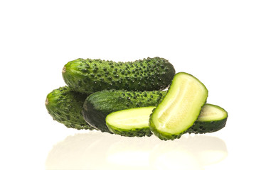 Fresh green cucumbers isolated on a white background.