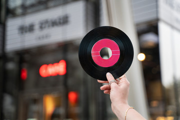 Girl Holding a Vinyl Record with cover