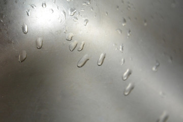 drops on a metal surface. Abstract background template can be used as a wall paper screen saver page cover