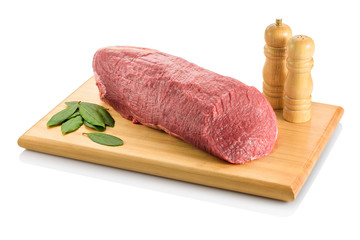 Raw eye round, a beef steak from the rear leg of the cow, ready to be cooked. On a cutting board...