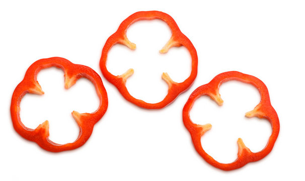 Red bell pepper ring slices on white background