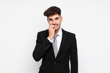 Young businessman over isolated white background nervous and scared