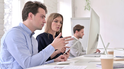 Fototapeta premium Startup Team Working on Desktop and Tablet Together