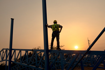 Technicians, engineers on steel platforms, technicians look up and analyze unfinished construction projects.