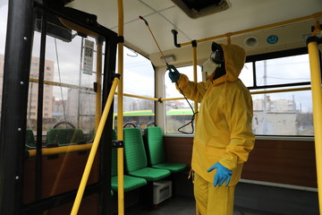 Workers disinfect a trolleybus after it arrived at a bus depot.The first case of novel coronavirus Covid-19 has been confirmed in Ukraine.