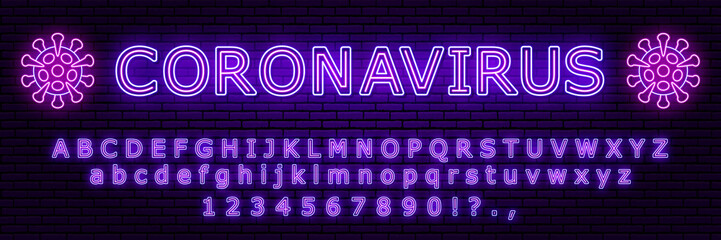 Obraz premium Neon sign in the form of a coronavirus, with the inscription. Includes a neon alphabet and numbers, each character is isolated. Against a brick wall. for your design. Purple and blue colors.