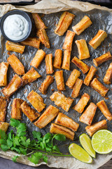 Fried yucca, yuca, cassava, manioca, mandioca with cilantro sauce