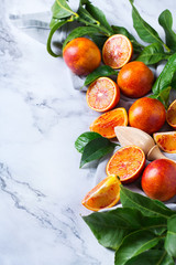 Sweet sicilian blood oranges on a marble table