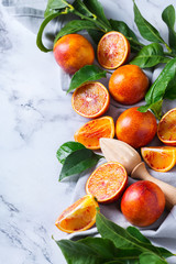Sweet sicilian blood oranges on a marble table