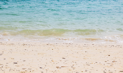 Tropical beach view with sand, sea with waves. Minimal, summer and travel concept. Phuket, Thailand.