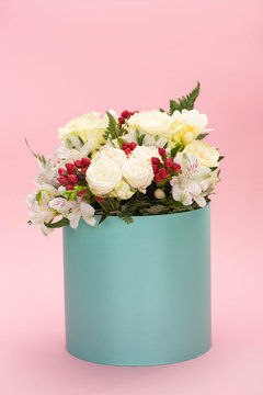 Bouquet Of Flowers In Turquoise Gift Box On Pink Background