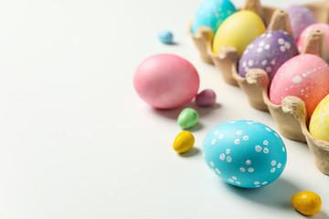 Fototapeta na wymiar Multicolor Easter eggs on white background, space for text