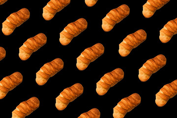 Bread on a black background. Contemporary art, minimalism.