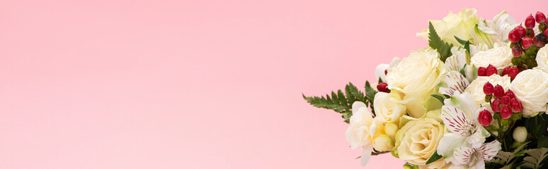 panoramic shot of bouquet of flowers isolated on pink