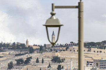 View of a bell tower of the Russian Church on Mount Eleon a street lamp in old district of Jerusalem city in Israel
