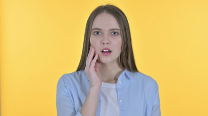 Upset Casual Young Woman Shocked by Results, Yellow Background