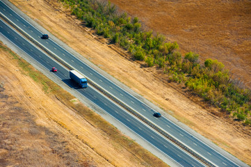 Aerial view over the road with cars