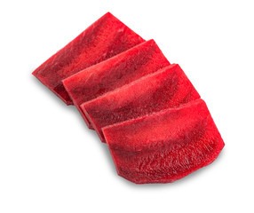 Halved and sliced beetroot on white background