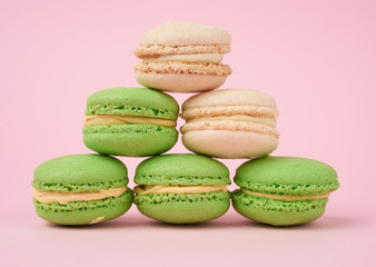 stack of white and green round almond flour cakes macarons