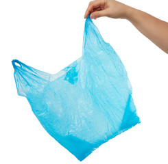 hand holds an empty blue plastic bag on a white background, concept of rejection of plastic