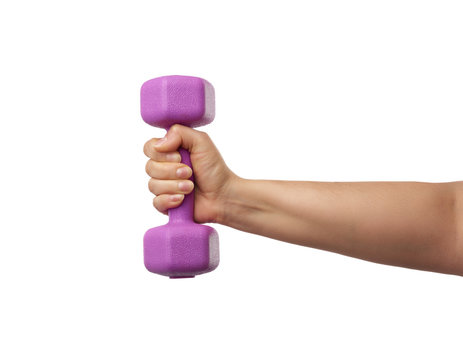 female hand holds a plastic pink dumbbell on a white isolated background