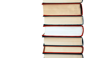 A stack of hardcover books on a white isolated background.