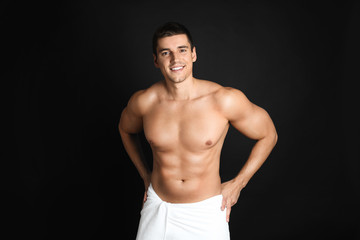 Fototapeta premium Man with sexy body on black background