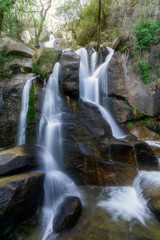 Waterfall falling slowly among the stones
