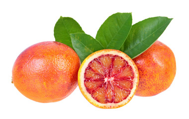 Composition with sliced and unpeeled ripe blood orange with green leaves isolated on white...