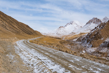 the gravel road on the snow mountain