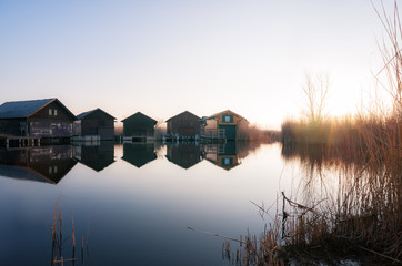 Log cabins on a canal at lake Neusiedlersee in Burgenland