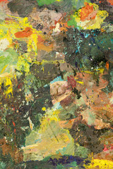 Background image of bright oil-paint palette closeup.