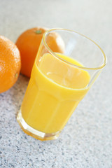 Freshly squeezed orange juice on a kitchen counter