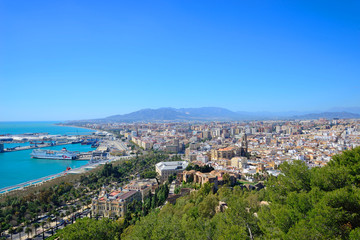 Malaga, Spain - March 4, 2020: Buildings of the city of Malaga next to the Mediterranean Sea.