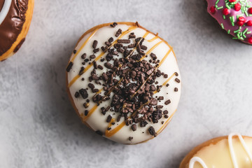 donuts with icing on grey background