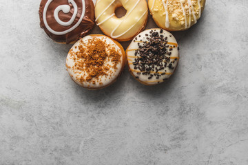 donuts with icing on grey background