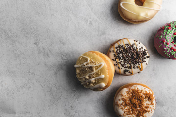 donuts with icing on grey background