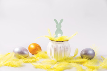 Three Easter eggs on a gray background.