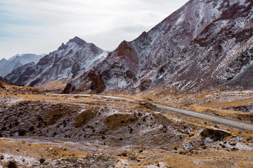 the gravel road on the snow mountain