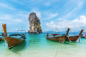 Thai traditional wooden longtail boat and beautiful sand beach at Koh Poda island in Krabi province.  Ao Nang, Thailand ,Krabi island is a most popular tourist destination in Thailand