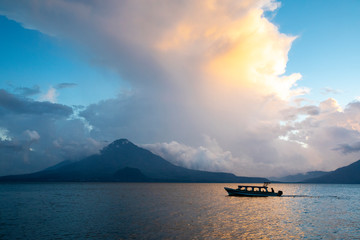 small voat on a lake Atitlan