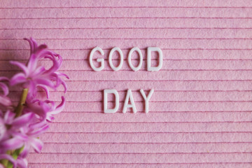 Good day words on pink background.