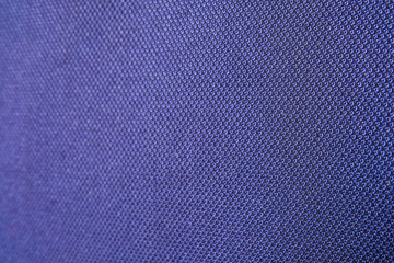 Close up shot of midnight dark blue formal suit cloth textile surface. wool fabric texture for important luxury evening or night event. Wallpaper and background with copy space for text