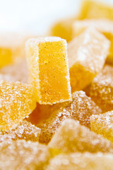 Pineapple, lemon, vanilla pate de fruit (jelly, marmalade, fruit candy) covered with sugar. White...