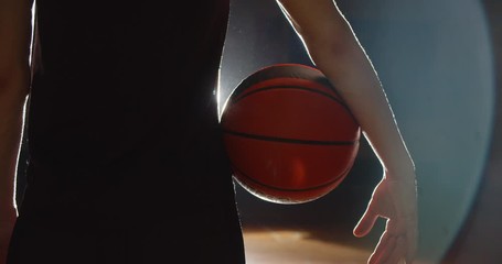 Close-up basketball ball player darkness shadow silhouette gym