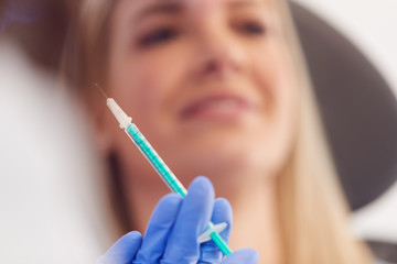 Beautician Or Doctor Preparing Female Patient For Anti Ageing  Injection