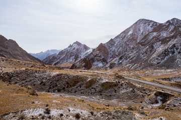the gravel road on the snow mountain