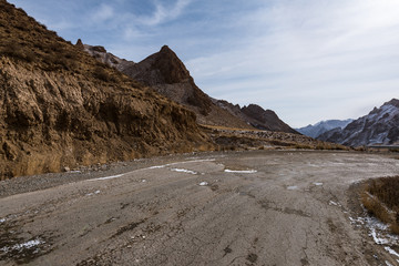the gravel road on the snow mountain