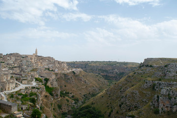 Fototapeta na wymiar Landscape of the Sassi di Matera, Italy. Ancient cave dwellings inhabited since the Paleolithic period.
