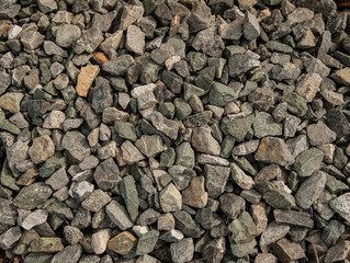 the surface is made of horizontal old gray boards,background from the gray stones of the small size,background from the gray stones of the small sizetexture of the gray gravel of small size,